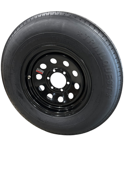 Black tire with rim on a white background 235 80r16 6 lug trailer tire
